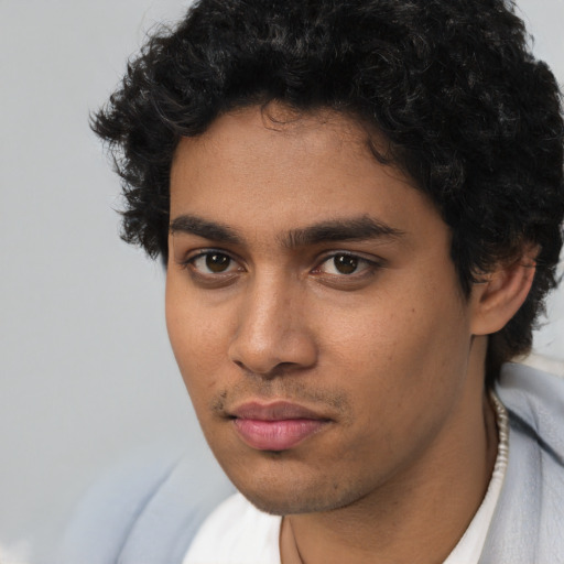 Neutral latino young-adult male with short  brown hair and brown eyes