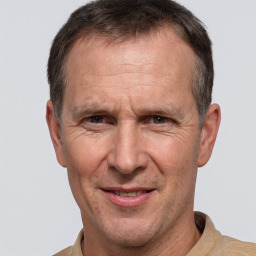 Joyful white middle-aged male with short  brown hair and brown eyes