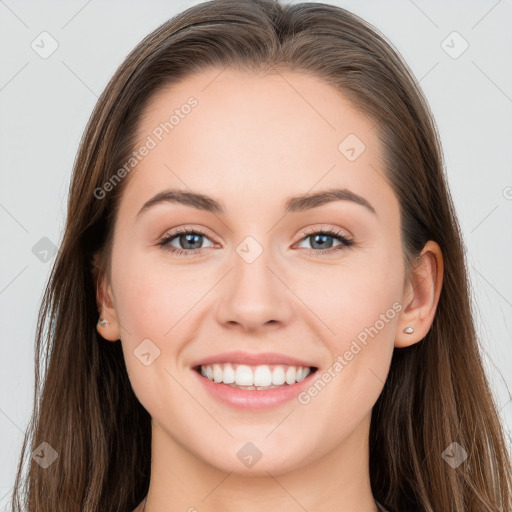 Joyful white young-adult female with long  brown hair and grey eyes