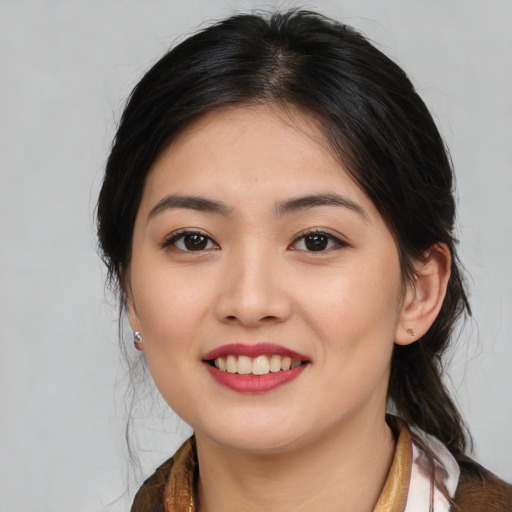 Joyful white young-adult female with medium  brown hair and brown eyes