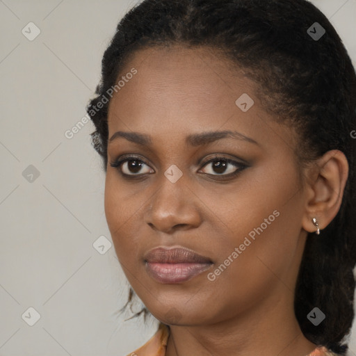 Joyful black young-adult female with long  brown hair and brown eyes