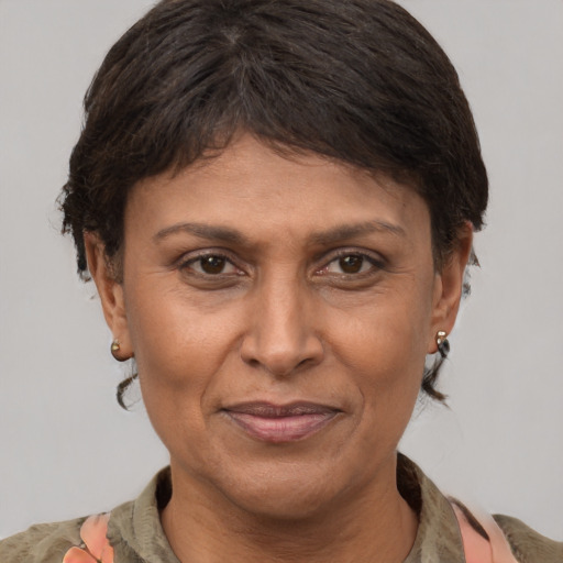Joyful white adult female with medium  brown hair and brown eyes