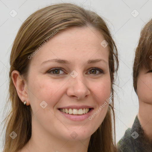 Joyful white young-adult female with long  brown hair and grey eyes