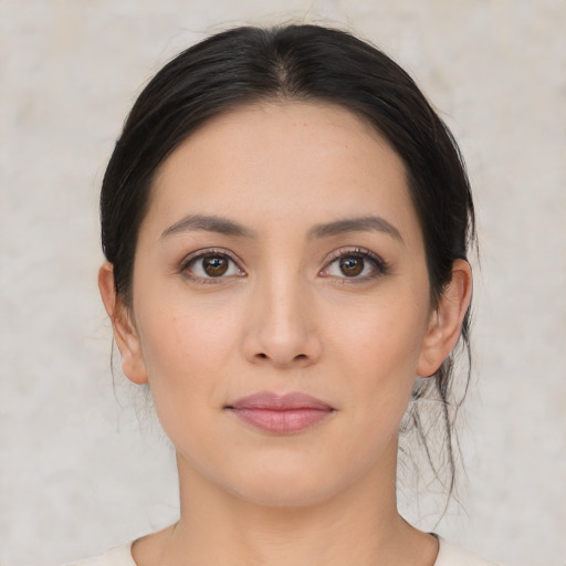 Joyful white young-adult female with medium  black hair and brown eyes
