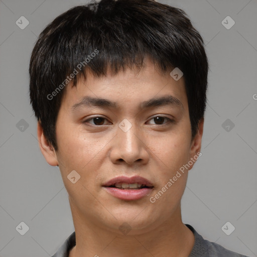 Joyful asian young-adult male with short  brown hair and brown eyes