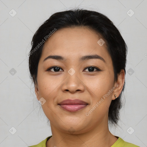 Joyful asian young-adult female with medium  black hair and brown eyes