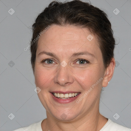 Joyful white adult female with short  brown hair and brown eyes