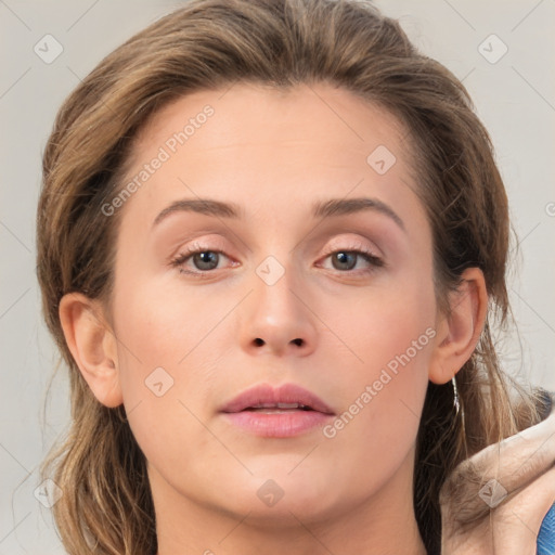 Joyful white young-adult female with medium  brown hair and blue eyes