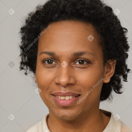 Joyful black adult female with short  brown hair and brown eyes