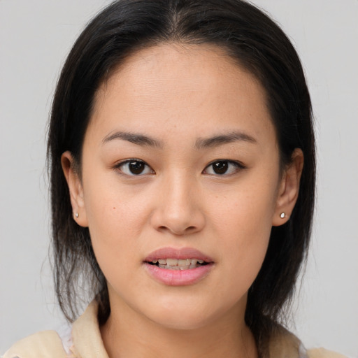 Joyful asian young-adult female with medium  brown hair and brown eyes