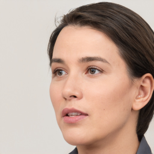 Neutral white young-adult female with medium  brown hair and brown eyes