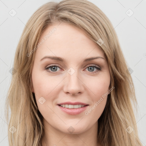 Joyful white young-adult female with long  brown hair and green eyes