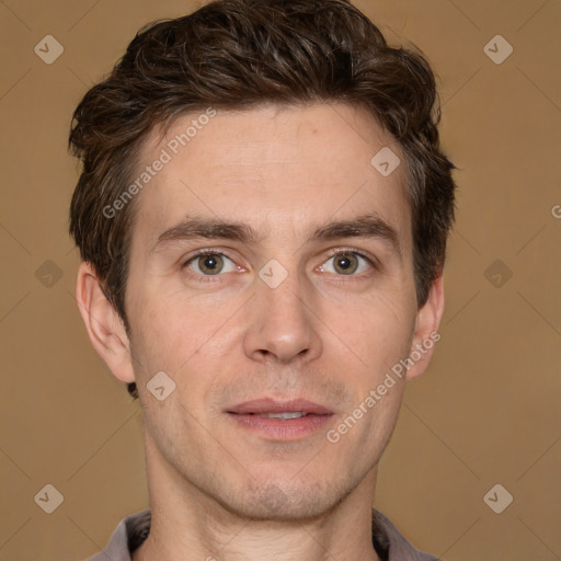 Joyful white adult male with short  brown hair and grey eyes