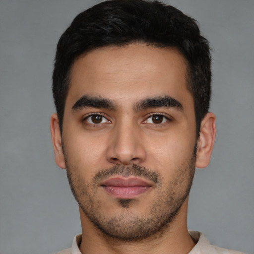 Neutral latino young-adult male with short  black hair and brown eyes