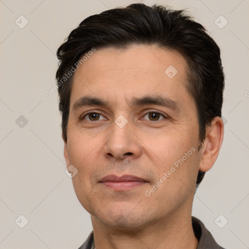 Joyful white adult male with short  brown hair and brown eyes