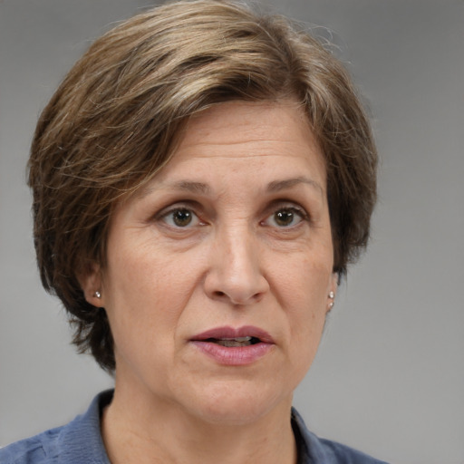 Joyful white middle-aged female with medium  brown hair and grey eyes