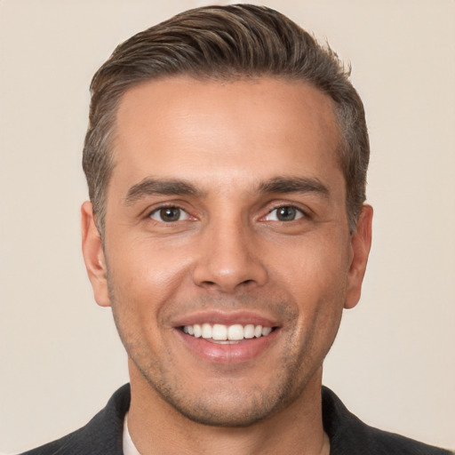 Joyful white young-adult male with short  brown hair and brown eyes