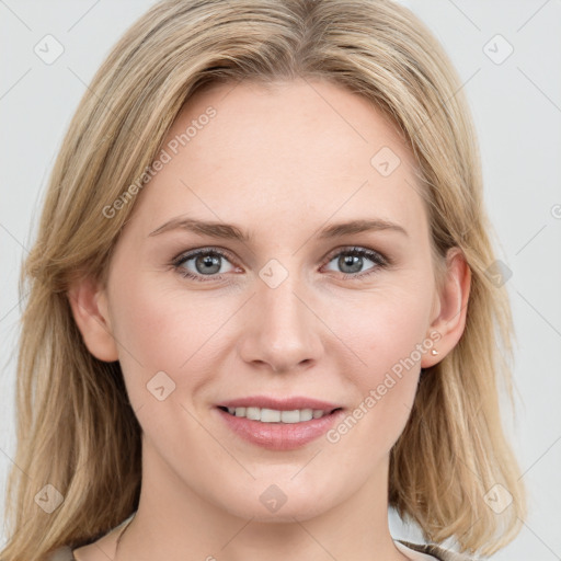 Joyful white young-adult female with long  brown hair and blue eyes