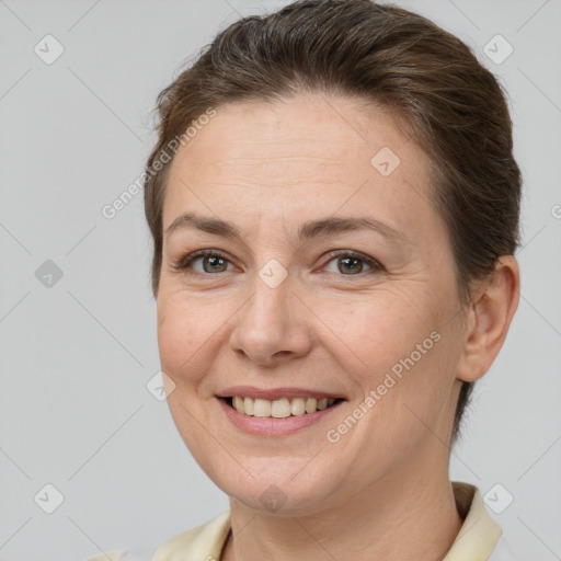 Joyful white adult female with short  brown hair and brown eyes