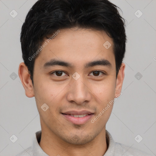 Joyful asian young-adult male with short  brown hair and brown eyes