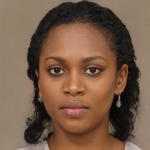 Neutral black young-adult female with medium  black hair and brown eyes