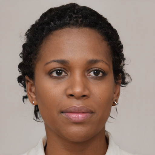 Neutral black young-adult female with short  brown hair and brown eyes