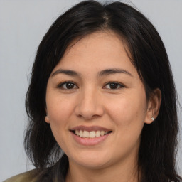 Joyful asian young-adult female with medium  brown hair and brown eyes