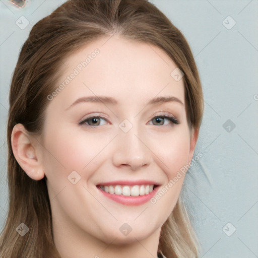 Joyful white young-adult female with long  brown hair and blue eyes