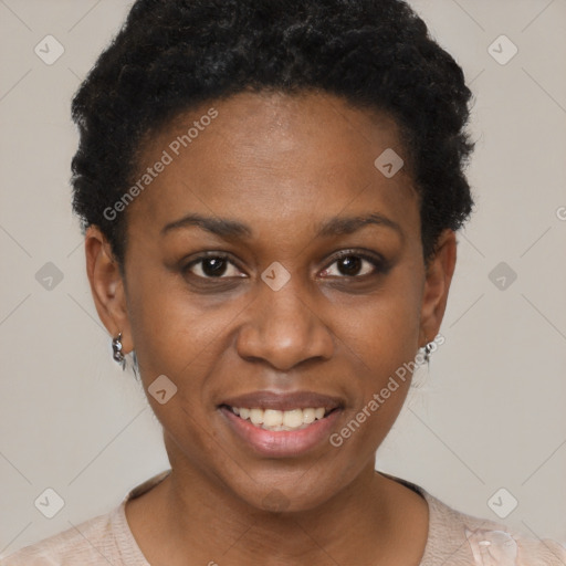 Joyful black young-adult female with short  black hair and brown eyes