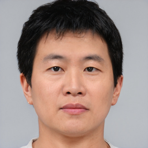 Neutral asian young-adult male with short  brown hair and brown eyes