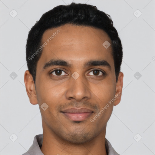 Joyful latino young-adult male with short  black hair and brown eyes