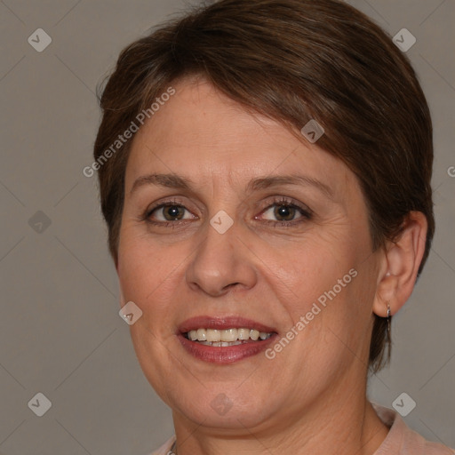 Joyful white adult female with short  brown hair and brown eyes