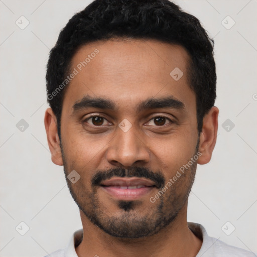 Joyful latino young-adult male with short  black hair and brown eyes