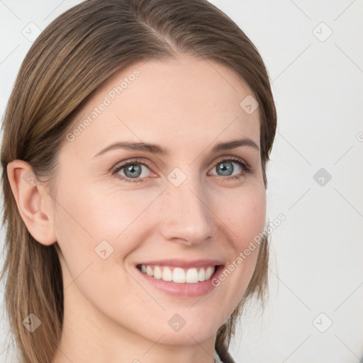 Joyful white young-adult female with long  brown hair and blue eyes