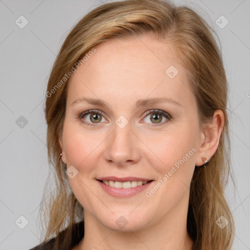 Joyful white young-adult female with medium  brown hair and blue eyes