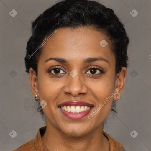 Joyful black young-adult female with short  brown hair and brown eyes