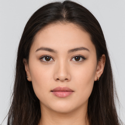 Neutral white young-adult female with long  brown hair and brown eyes