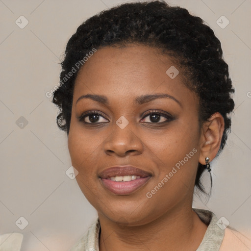 Joyful black young-adult female with medium  black hair and brown eyes