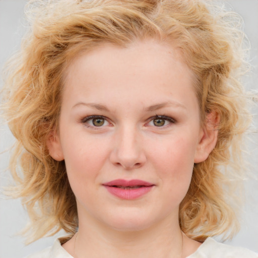 Joyful white child female with medium  brown hair and blue eyes