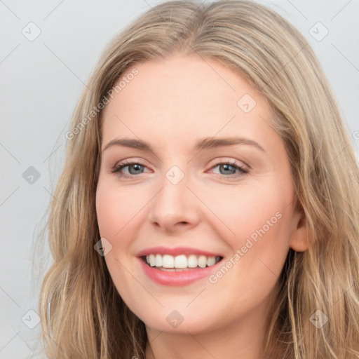 Joyful white young-adult female with long  brown hair and blue eyes