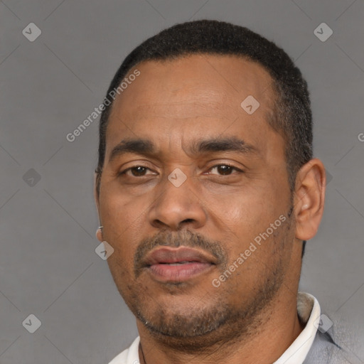 Neutral black adult male with short  black hair and brown eyes