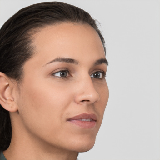 Neutral white young-adult female with medium  brown hair and brown eyes