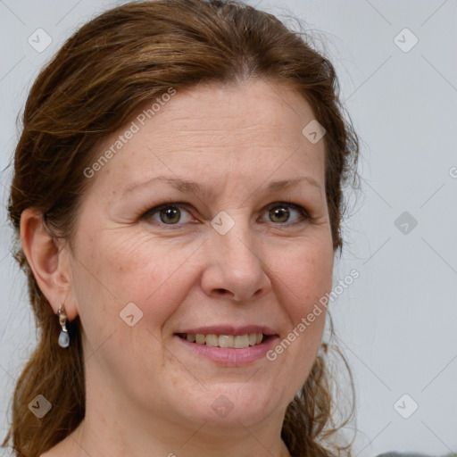 Joyful white adult female with medium  brown hair and grey eyes