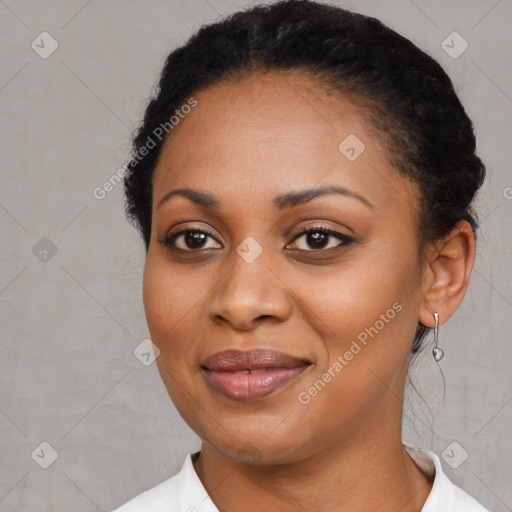 Joyful black young-adult female with medium  black hair and brown eyes