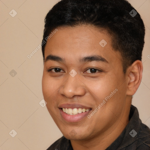 Joyful latino young-adult male with short  brown hair and brown eyes