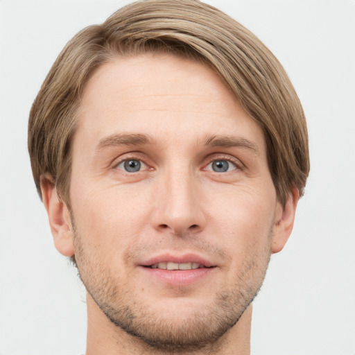 Joyful white adult male with short  brown hair and grey eyes