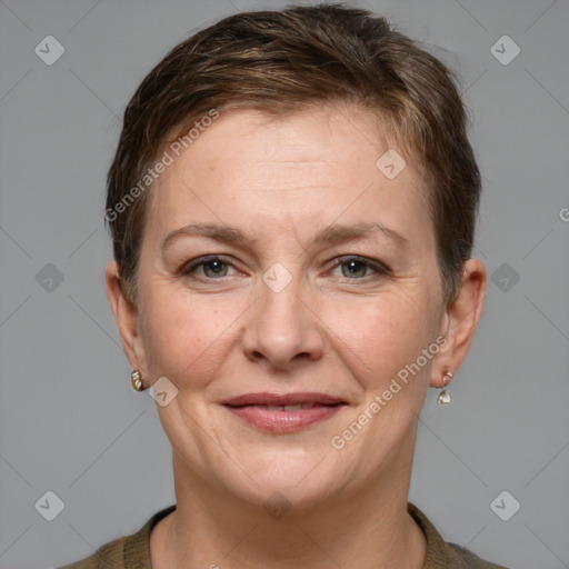 Joyful white adult female with short  brown hair and grey eyes