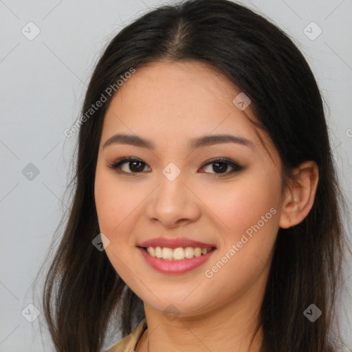 Joyful asian young-adult female with long  brown hair and brown eyes