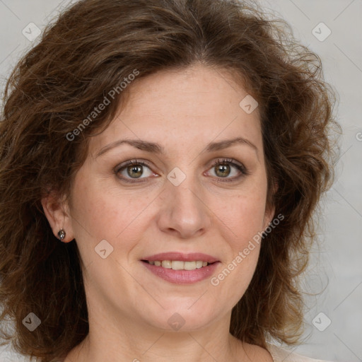 Joyful white adult female with medium  brown hair and green eyes