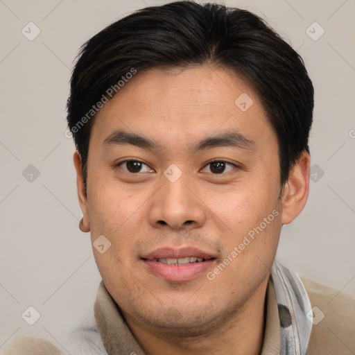 Joyful asian young-adult male with short  brown hair and brown eyes